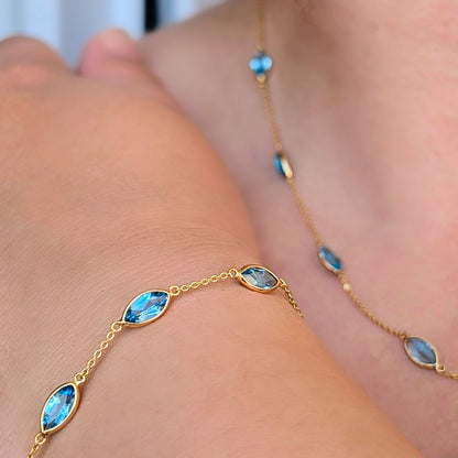 Aqua Flow – 18K Marquise Blue Topaz Bracelet